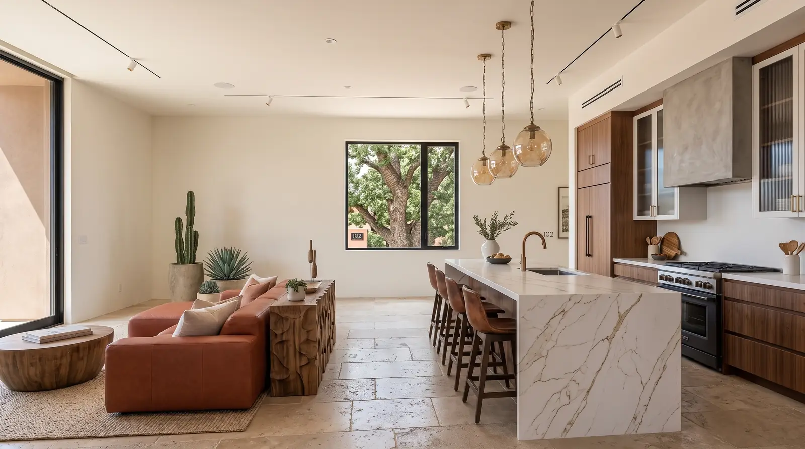 Open-plan kitchen and living space with an island and pendant lighting