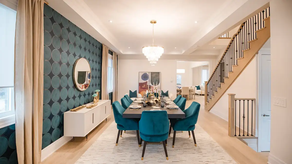 Dining area beside a staircase, with a patterned feature wall
